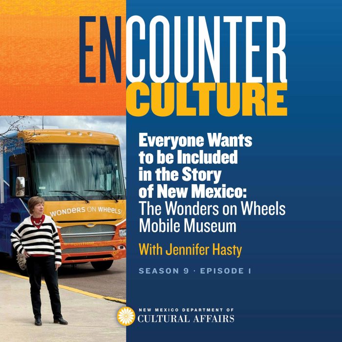 A woman stands in front of the Wonders on Wheels Mobile Museum truck, featured in promotional material for Encounter Culture podcast, Season 9, Episode 1.